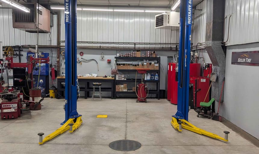 Two-post vehicle lift in Seiler Tire's general maintenance service bay